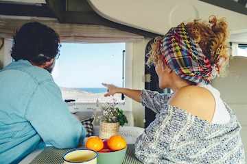 Modern happy ladies travelling enjoying life at the beach on