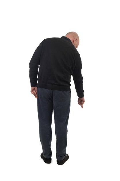 back view of a man pointing finger at the ground isolated on white background