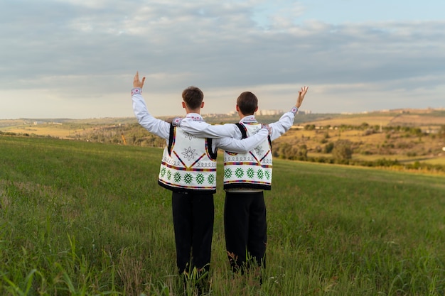 Back view man wearing traditional clothes