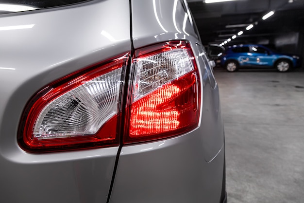 Back view of new  silver city crossover, Closeup headlights of car  SUV, 