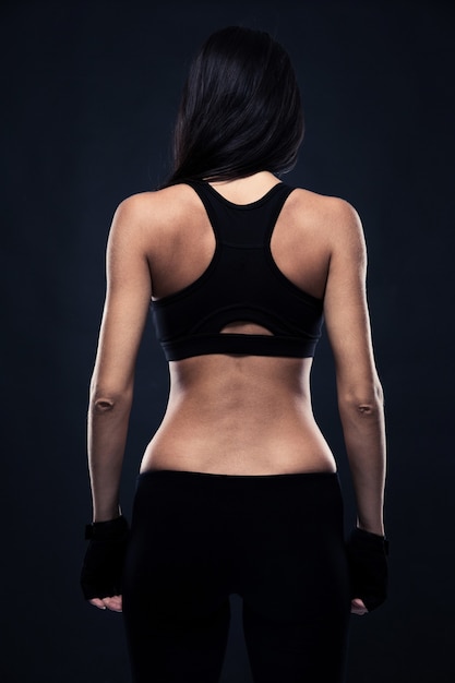 Back view portrait of a fitness woman