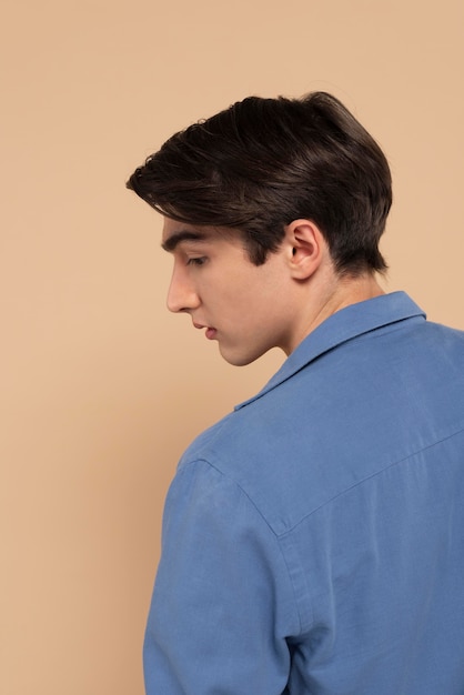 Back view portrait young man posing