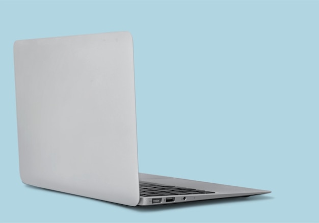 Back view of a rotated at a slight angle modern laptop . High quality.