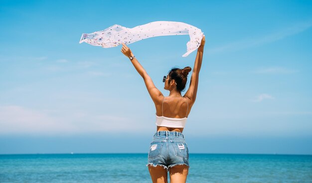 Back view of sexy body woman on paradise tropical beach