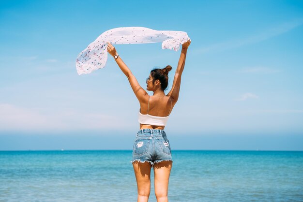 Back view of sexy body woman on paradise tropical beach