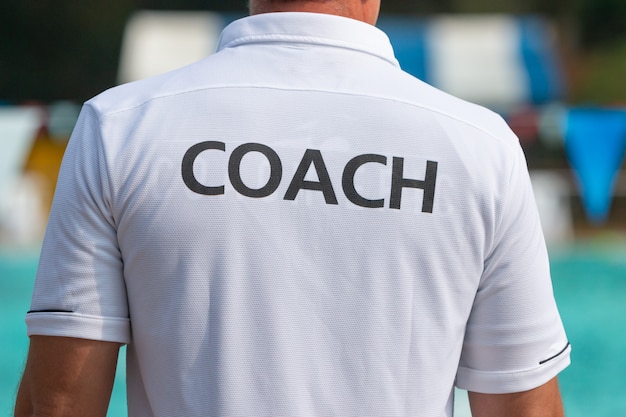 Photo back view of sport coaches