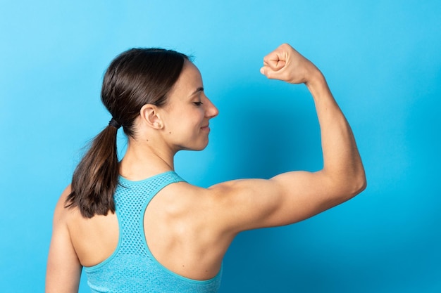 Back view of sportswoman showing biceps