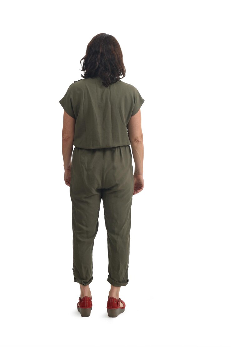 back view of woman dressed in jumpsuit on white background