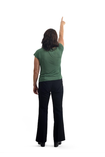 Photo back view of a woman pointing up on white background