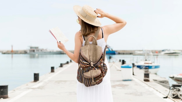 Back view woman wearing backpack