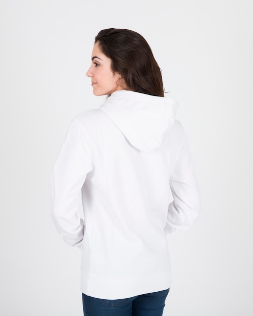 Back view of woman wearing white hoodie