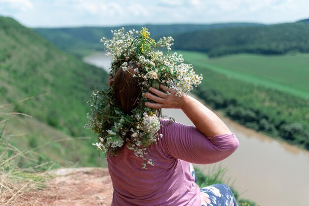 Back view of a woman wearing a wreath of flowers