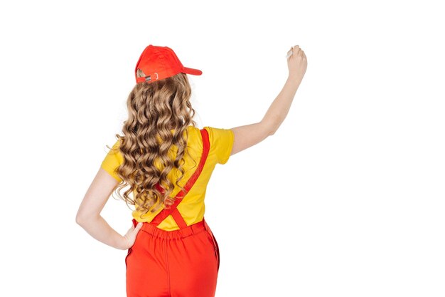 Back view of woman wearing yellow uniform writing at the whiteboard Rear view people collection backside view of person