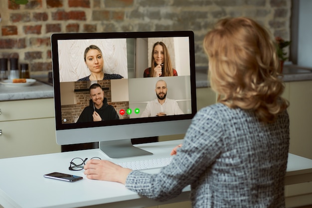 A back view of a woman who works remotely