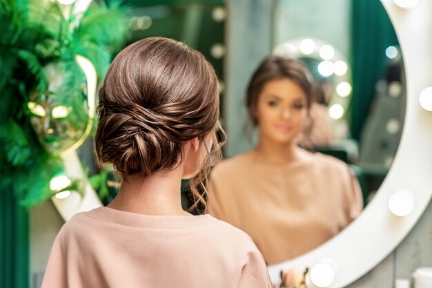 Back view of woman with hairstyle.