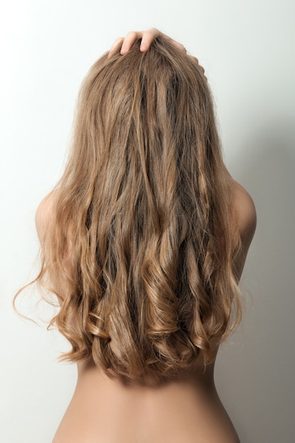 Back view of a woman with long blond hair