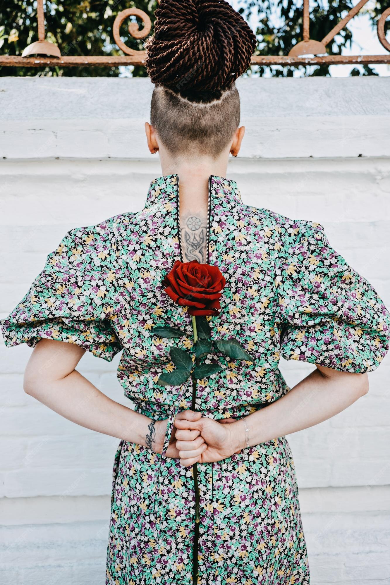 Premium Photo | Back view of woman with tattoo ukrainian trident symbol holds a red rose in her hands ukrainian Premium Photo | Back view of woman with tattoo ukrainian trident symbol holds a red rose in her hands ukrainian