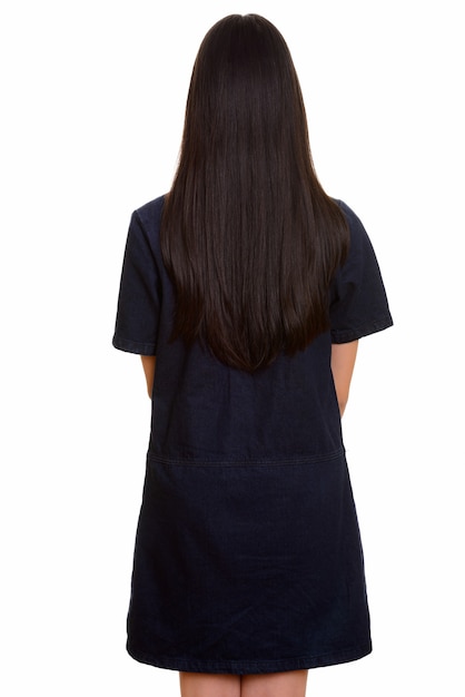 Photo back view of young asian teenage girl