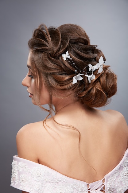 Photo back of women's head looking sideways with professional hairstyle