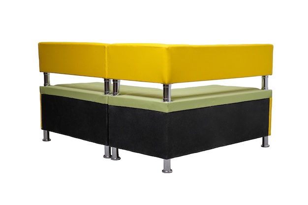 Back of yellow leather office sofa with metal chrome legs isolated