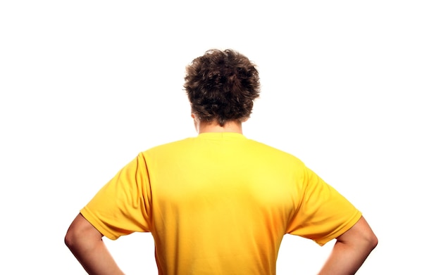 the back of a young man standing against white background