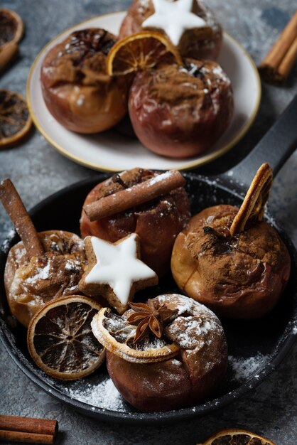 Backed apples in the iron cast skillet decorated with star cookies