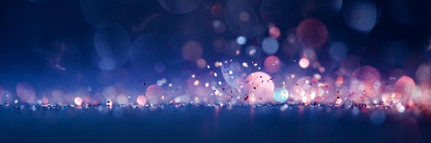 Photo background of abstract  blue and pink glitter lights. defocused