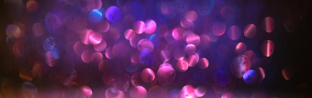 Background of abstract glitter lights purple and black