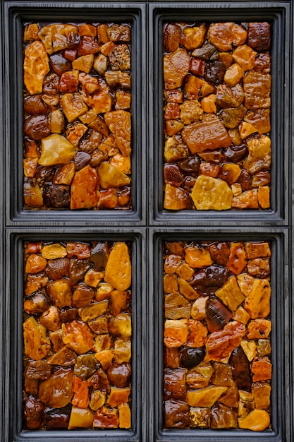 Background amber stone in a wooden window frame