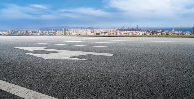 Background of asphalt pavement and urban architectural landscape skyline