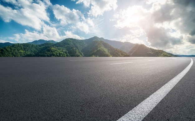 Background of asphalt pavement and urban architectural landscape skyline