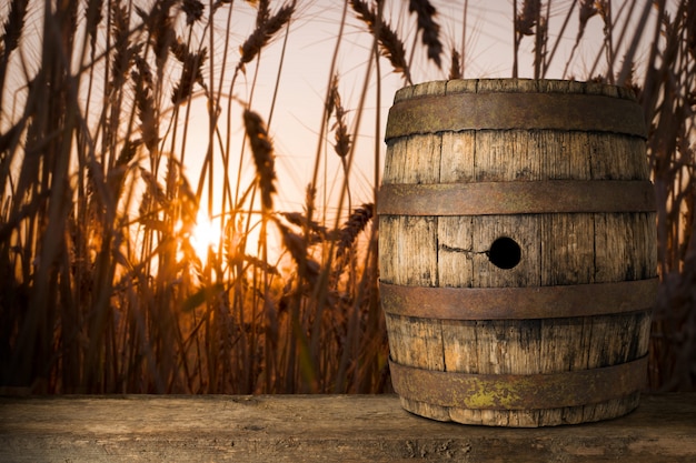 background of barrel and worn old table of a wheat background