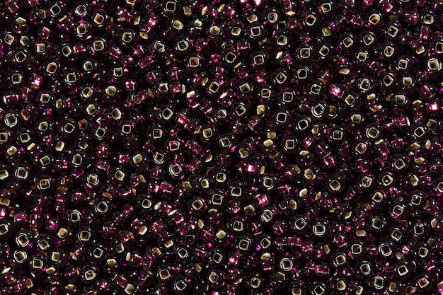 Background of black and red seed beads. High resolution photo.