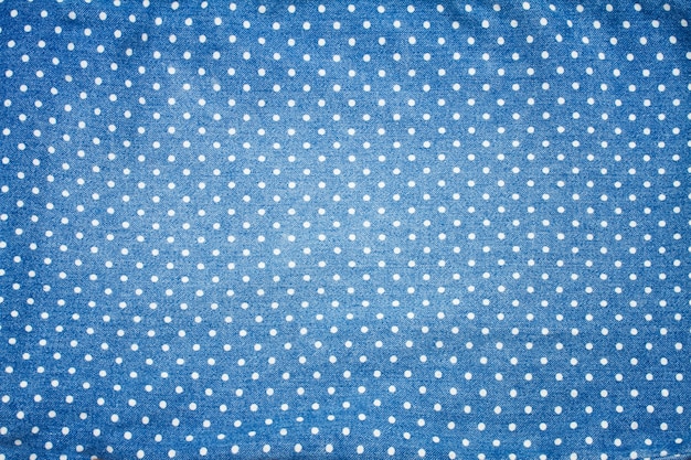 Background of blue jeans with polka dot pattern