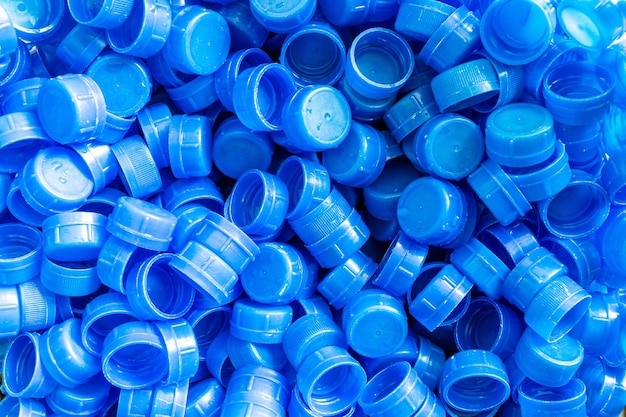 Background of blue plastic water bottle cap Lots of piles togetherClosup