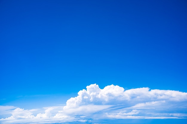 Background blue sky and white clouds seen from plane window There is space for writing content Natural sky bright style