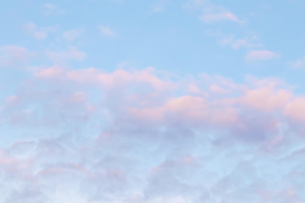 Background of blue sky with pink clouds in sunset