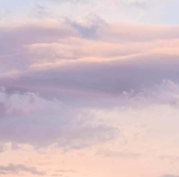 Background of blue sky with white and pink clouds in sunset High quality photo