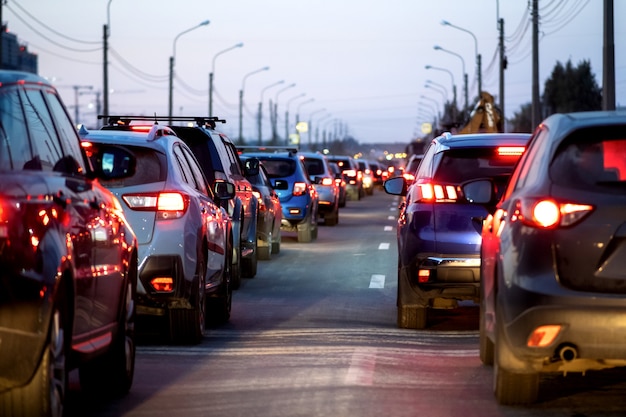 Background, blur, out of focus, bokeh. traffic jams, road\
repairs, or accidents. red brake lights of stopped cars.