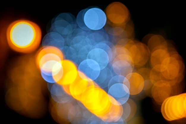 Background blurred abstraction of colored lanterns and decorations. bokeh texture of street colored lights