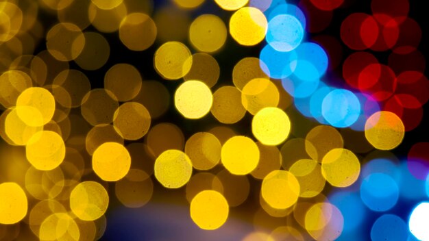 Background blurred abstraction of colored lanterns and decorations. bokeh texture of street colored lights