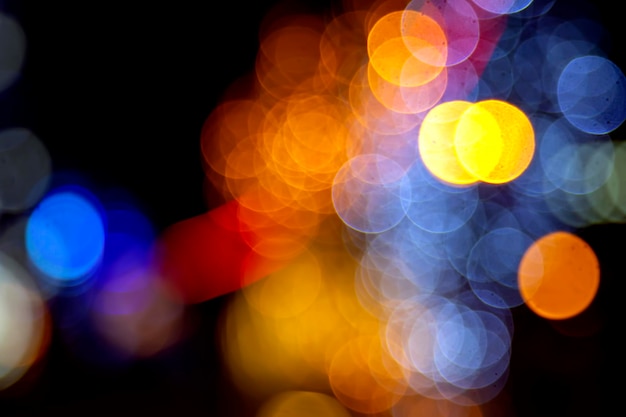 Background blurred abstraction of colored lanterns and decorations. bokeh texture of street colored lights