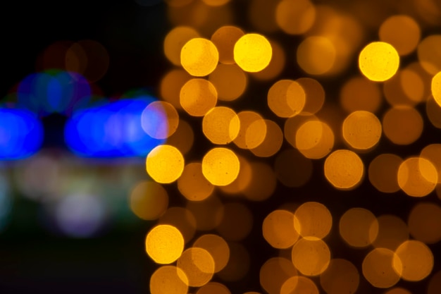 Background blurred abstraction of colored lanterns and decorations bokeh texture of street colored lights