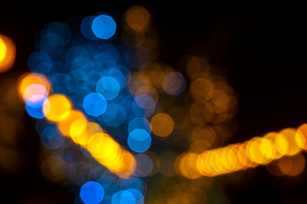 Background blurred abstraction of colored lanterns and decorations bokeh texture of street colored lights