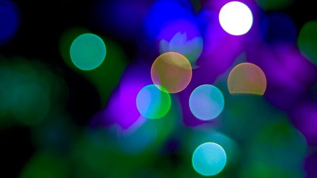 Background blurred abstraction of colored lanterns and decorations bokeh texture of street colored lights