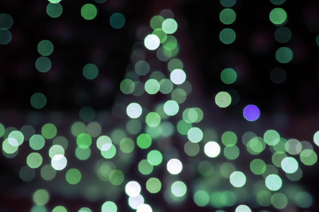 Background blurred abstraction of colored lanterns and decorations bokeh texture of street colored lights