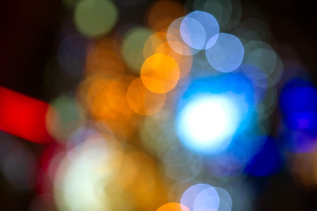 Background blurred abstraction of colored lanterns and decorations bokeh texture of street colored lights