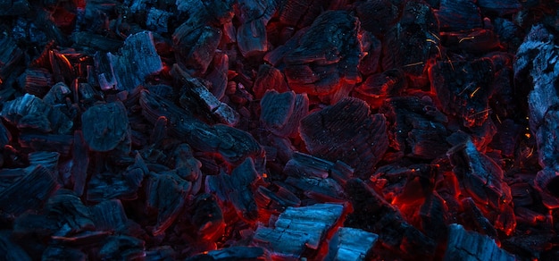 Background of burning coals in the dark