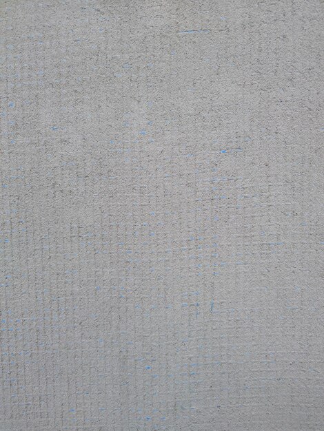Background cement sand plaster with blue reinforcing mesh