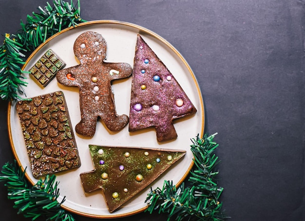 Background of chocolate bars. chocolate new year figures.\
gingerbread man chocolate